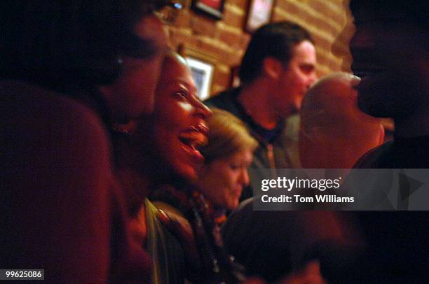 From left, Crystal Ellerbe, Lisa LeVert, and Ramon Long, share a laugh on opening night of the Pug on H street, NE.