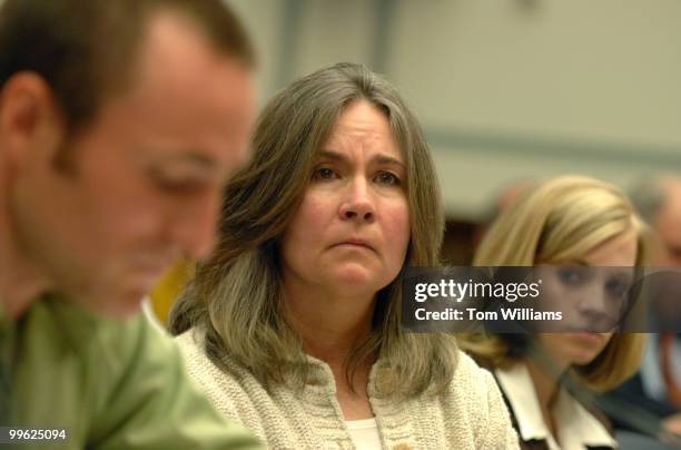 Mary Tillman, mother of Cpl. Pat Tillman, a former NFL player killed by friendly fire in Afghanistan, listens to her son Kevin, who also served with...