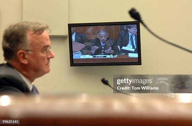 John Tanner, chief of the Voting Section of the Civil Rights Division at the Department of Justice, listens to an opening statement of Chairman of...