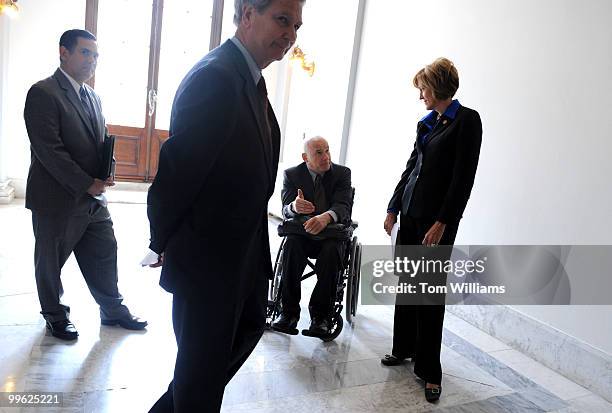 Rep. Walter Jones, R-N.C., foreground, waits for the arrival of Sen. Frank Lautenberg, D-N.J., while Rep. Betty Sutton, D-Ohio, talks with Bobby...