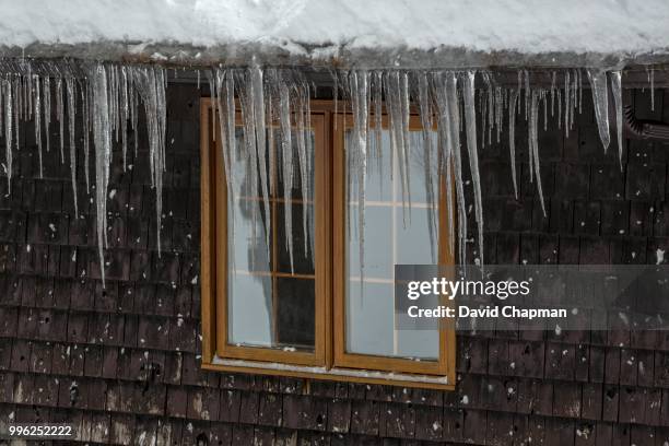 old window with icicles, eastern townships, potton, quebec, canada - eastern townships quebec stock pictures, royalty-free photos & images