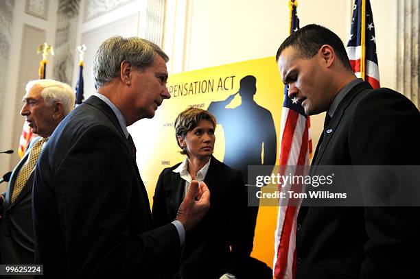 Rep. Walter Jones, R-N.C., talks with Colby Buzzell, an Iraq veteran who whose service was extended due to "stop loss" as Kimberly Peirce, director...