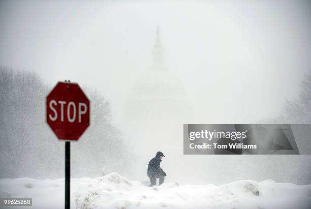 Mike Seidel, a meteorologist with The Weather Channel, conducts a live tv spot on a snow bank in Upper Senate Park, during a winter storm expected to...