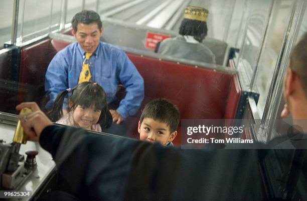 Jay Allen Snyder-Pham and his sister Jeanne ride the Russell subway as their father Thinh Pham of the Senate Recording Studio, looks on, April 23,...