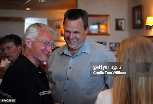 Senate candidate Jon Tester talks with guests at a fundraiser at the Mint Bar and Cafe in Belgrade, Montana.