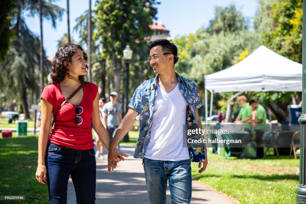 Los Angeles Couple Walking Through Park During Farmer's Market