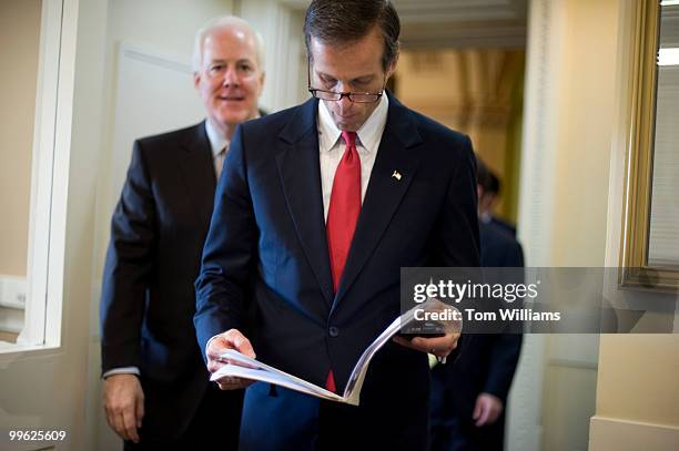 Sens. John Thune, R-S.D., right, and John Cornyn, R-Texas, arrive at a news conference on how the health care bill may hinder job creation, Dec. 03,...