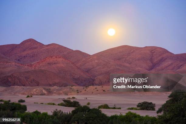 moonrise over the mountains, full moon, purros, kunene region, namibia - kunene region stock pictures, royalty-free photos & images