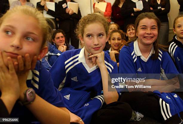 Fifth Grade soccer players from "The Lightning" from Great Fall, Va., from left, Gavin Taylor Haley Mercer and Mary Riley Pembroke listen to Mia...