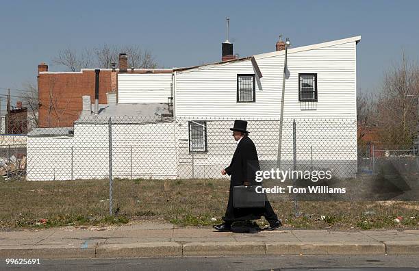 Man walks west on the 300 block of H Street, NE.