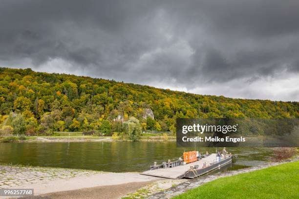 ferry across the danube with thunderclouds near matting, bavaria, germany - engels stock pictures, royalty-free photos & images