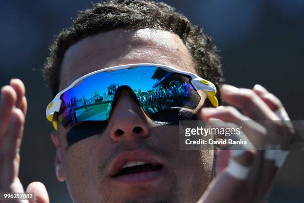 Javier Baez of the Chicago Cubs pin the dugout in a game against the Cincinnati Reds on July 8, 2018 at Wrigley Field in Chicago, Illinois. The Cubs...