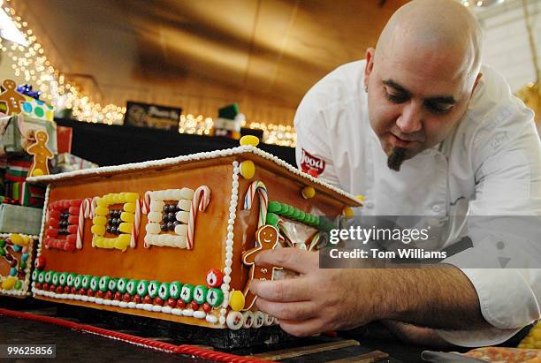 Duff Goldman, host of Food Network's Ace of Cakes, creates a gingerbread cake in the form of a train to accompany a life-size Starbucks Gingerbread...