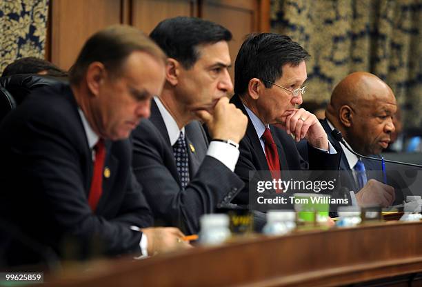 From left, Reps. Brian Bilbray, R-Calif., Darrell Issa, R-Calif., Dennis Kucinich, D-Ohio, and Elijah Cummings, D-Md., listen to testimony from Neel...