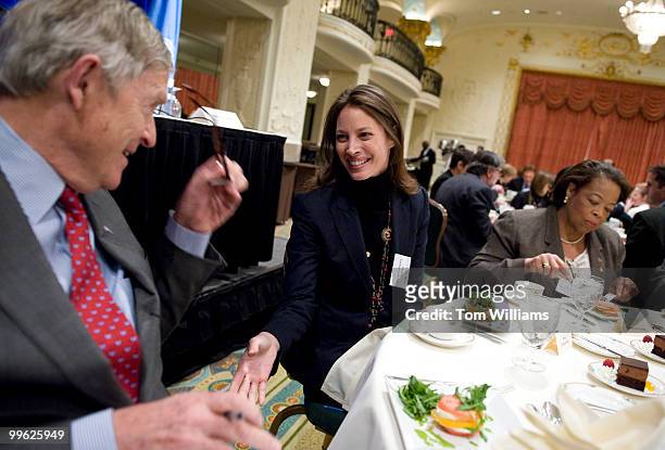 Christy Turlington Burns, CARE advocate for maternal health, greets former senator Timothy Wirth, president of the United Nations Foundation, during...