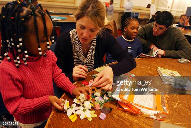 Tutor Cade King sorts silk flowers with Ashley Bolton, during a Monday night tutoring session in Cannon sponsered by Horton Kids and Hill Help.