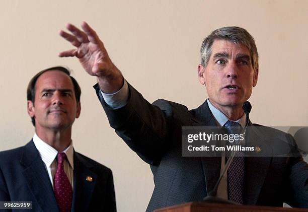 Reps. Mark Udall, D-Colo., speaking, and Zach Wamp, R-Tenn., attend the Eighth Annual Congressional Renewable Energy and Energy Efficiency Forum and...