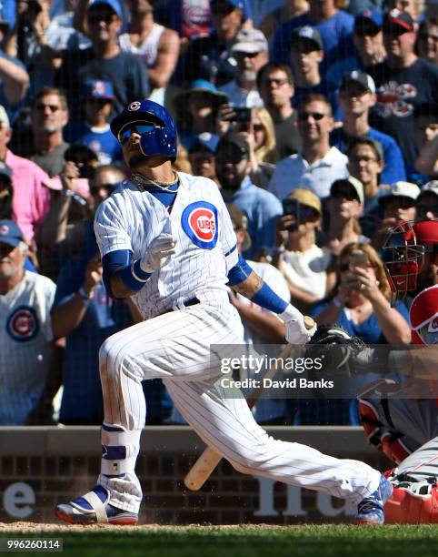 Javier Baez of the Chicago Cubs bats against the Cincinnati Reds on July 8, 2018 at Wrigley Field in Chicago, Illinois. The Cubs won 6-5 in ten...