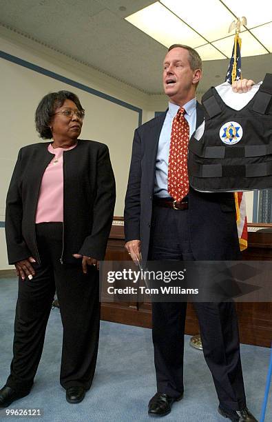 Rep. Joe Wilson, R-S.C., holds up a bulletproof vest alongside Shirley Gibson, of Concerns of Police officer Survivors , whose son Brian Gibson of...