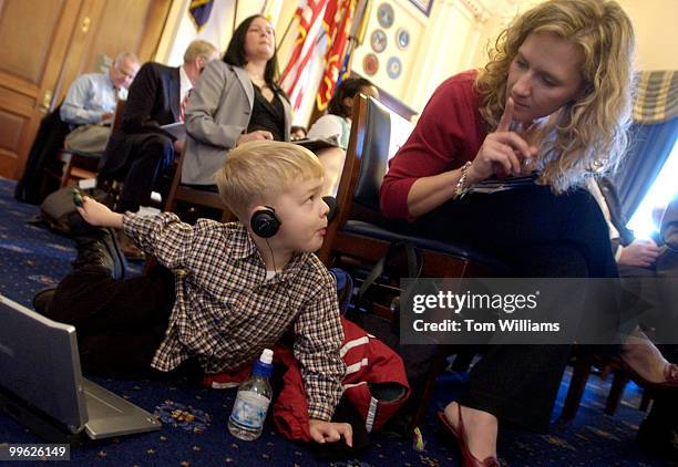 Jennifer McCollum of Jackonsville, Fla., quiets her son Daniel, 3 1/2, at the start of a House Veterans' Affairs Committee on the underfunding of...