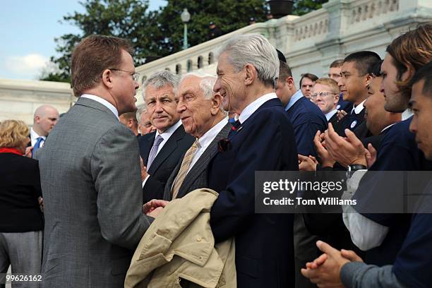 Sens. From left, Jim Webb, D-Va., Chuck Hagel, R-Neb., Frank Lautenberg, D-N.J., and John Warner, R-Va., attend rally with veterans to urge Congress...