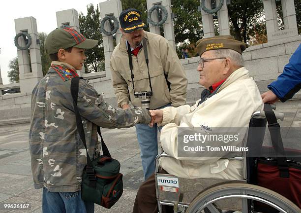 World War II veteran Donald Napier of Syracuse, talks with Cole Talton of Winchester, Va., near the European campaign section of the World War II...