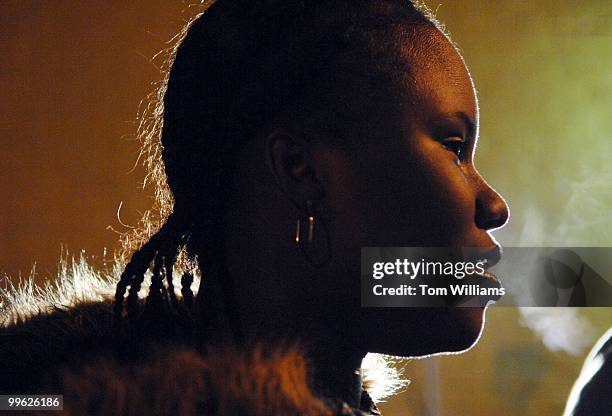 Rinita Hutchinson braves the cold while shooting a scene at the Multimedia Training Institute on W Street, Northeast. The scene involved in two guys...