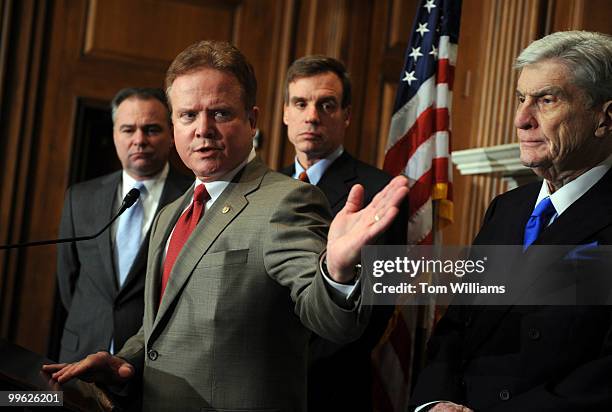 From left, Gov. Tim Kaine, D-Va., Jim Webb, D-Va, Sen.-elect Mark Warner, D-Va., and Sen. John Warner, R-Va., conduct a news conference on the Navy's...