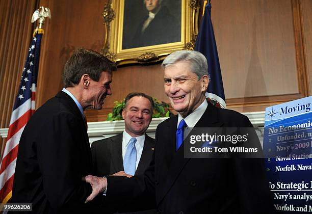 Sen. John Warner, R-Va., right, says goodbye to Sen.-elect Mark Warner, D-Va., left, and Gov. Tim Kaine, D-Va., after a news conference on the Navy's...