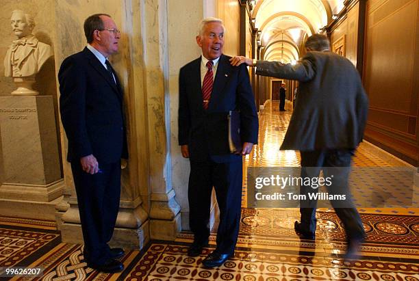 Sen. Richard Lugar, R-Ind., gets a pat on the shoulder from Senate Minority Leader, Harry Reid, D-Nev., while Lugar and Sen. Lamar Alexander,...