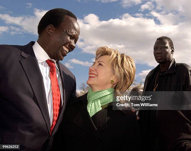Simon Deng, a former slave from Sudan, talks with Sen. Hillary Clinton, D-N.Y., at a rally which concluded his 300 mile Sudan Freedom Walk, on the...