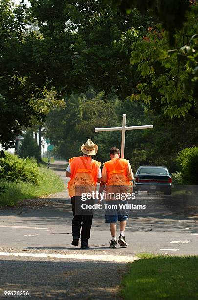 Carl Kennedy and Nathan Armes make their way along Route 50 in Arlington during a trek from their home in West Virginin to Washington, D.C., to make...