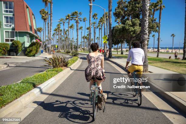 bicycling couple in santa monica, ca - santa monica stock pictures, royalty-free photos & images