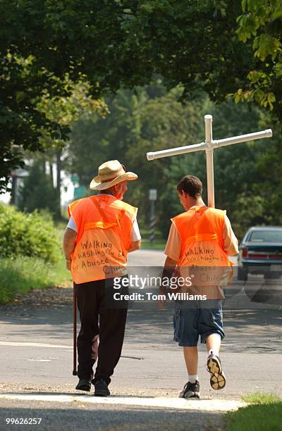 Carl Kennedy and Nathan Armes make their way along Route 50 in Arlington during a trek from their home in West Virginin to Washington, D.C., to make...