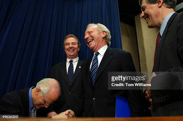Rep. Chris Shays, R-Conn., bows down to Sen. Joe Lieberman, D-Conn., as he arrives at a bipartisan news conference in support of the "Climate...