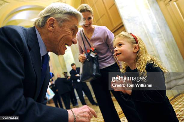 Sen. John Warner, R-Va., talks with Christina Murphy Dodd daughter of Sen. Chris Dodd, D-Conn., as her mother Jackie Clegg Dodd, looks on, on the...