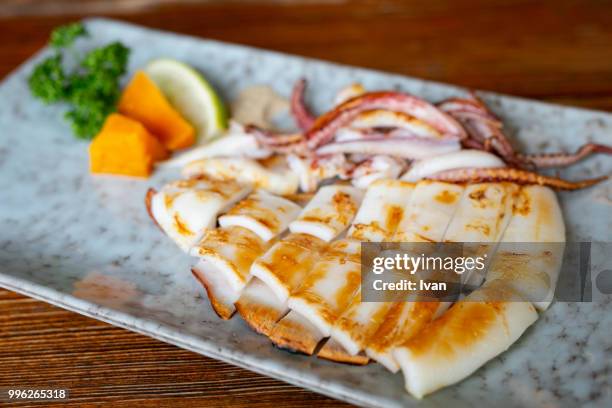 traditional japanese cuisine, food, grilled squids on the plate - cuttlefish stock pictures, royalty-free photos & images