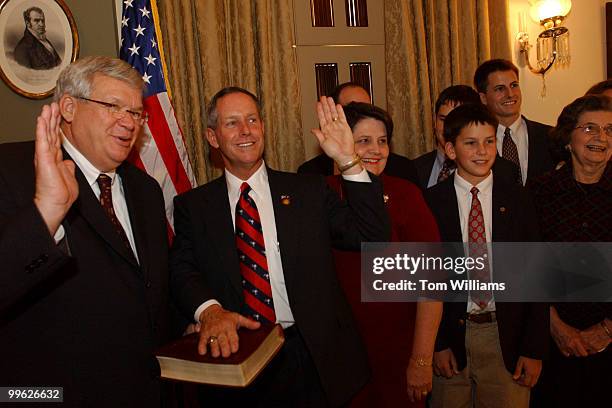 At the mock swearing in of Rep. Joe Wilson, R-S.C., are from left, Speaker Dennis Hastert, R-Ill., Wilson, wife Roxanne, sons Alan, Julian , Hunter...