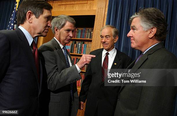 From leftt, Reps. Dennis Kucinich, D-Ohio, Walter Jones, R-N.C., Ron Paul, R-Texas, and Martin Meehan, D-Mass., talk before a news conference to...