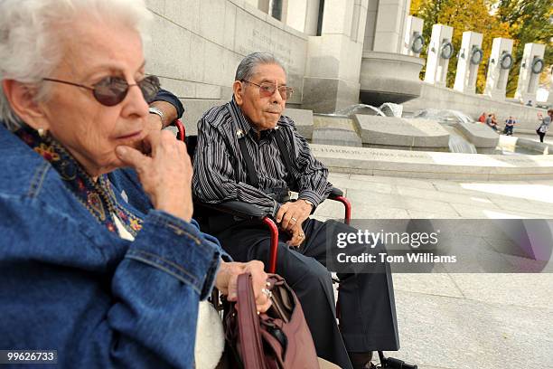 World War II veteran John Avilla and his wife Juanita, both 84 of Russell, Ky., take a break from touring the World War II memorial on the Mall,...