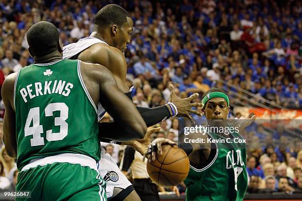Rajon Rondo of the Boston Celtics steals the ball from Dwight Howard of the Orlando Magic in Game One of the Eastern Conference Finals during the...