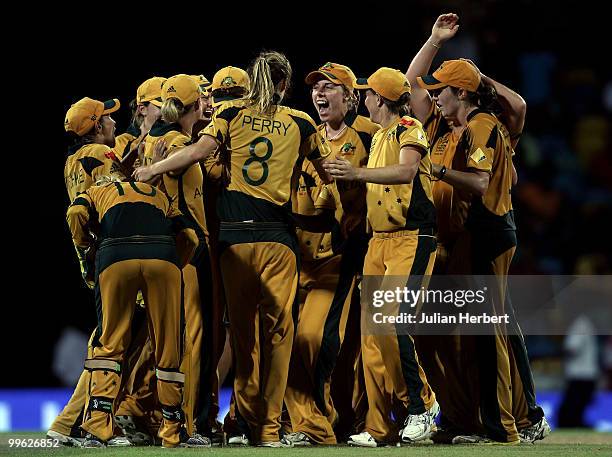 Australia players celebrate after wining the ICC Womens World Twenty20 Final between Australia and New Zealand played at the Kensington Oval on May...