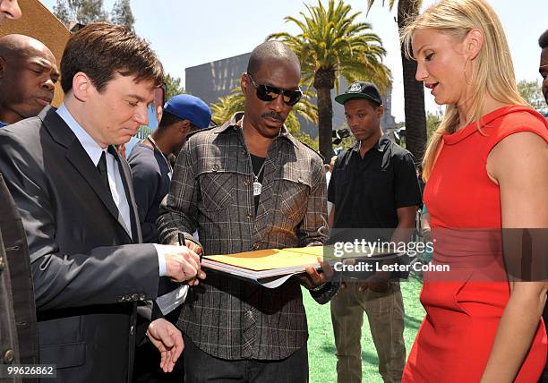 Actress Cameron Diaz has actors Mike Myers and Eddie Murphy sign her "Shrek" book at the "Shrek Forever After" Los Angeles premiere held at Gibson...