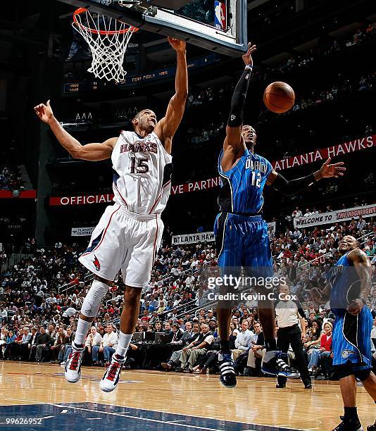 Al Horford of the Atlanta Hawks against Dwight Howard of the Orlando Magic during Game Four of the Eastern Conference Semifinals of the 2010 NBA...