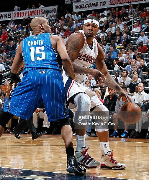Vince Carter of the Orlando Magic against Josh Smith of the Atlanta Hawks during Game Four of the Eastern Conference Semifinals of the 2010 NBA...