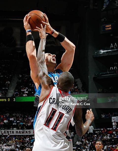 Marcin Gortat of the Orlando Magic against Jamal Crawford of the Atlanta Hawks during Game Four of the Eastern Conference Semifinals of the 2010 NBA...