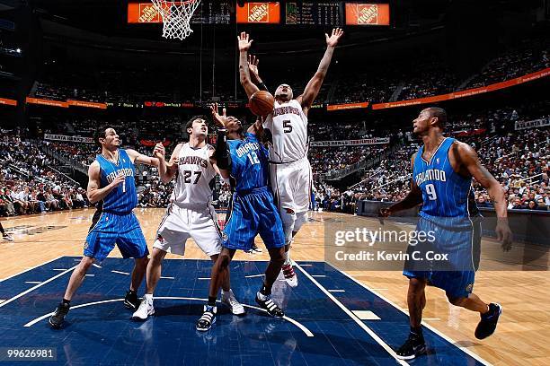 Redick, Dwight Howard and Rashard Lewis of the Orlando Magic against Zaza Pachulia and Josh Smith of the Atlanta Hawks during Game Four of the...