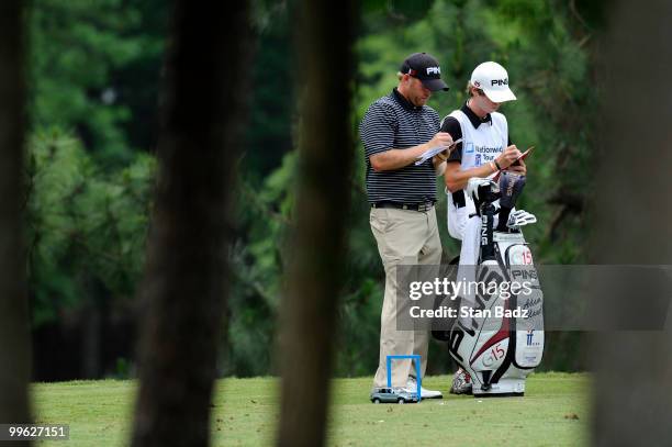 Adam Bland checks his yardage on the fourth hole during the final round of the BMW Charity Pro-Am presented by SYNNEX Corporation at the Thornblade...