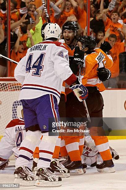 Braydon Coburn of the Philadelphia Flyers celebrates after his goal with teammates Danny Briere in the first period as Roman Hamrlik of the Montreal...