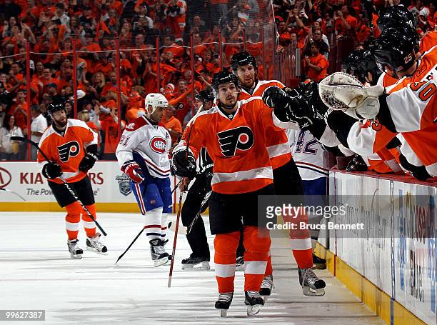 Danny Briere and Braydon Coburn of the Philadelphia Flyers celebrate with their bench after the first period goal by Coburn against the Montreal...